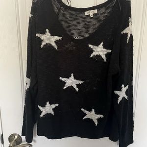 EUC black boutique sweater with white stars.  Size M/L